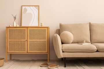 Cozy living room interior with mock up poster frame, rattan commode, beige sofa, round pillow,...