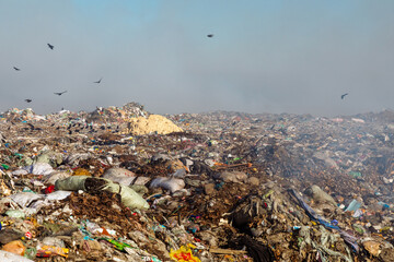 Burning trash piles in landfill