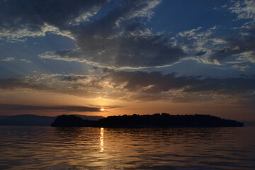 Fototapeta premium View of Lazareto island from a sailboat during sunrise.