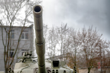 Fototapeta na wymiar Gun barrel directed from the tank turret
