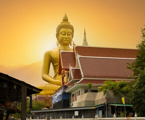 Bangkok's tallest Buddha statue at sunset. Visible up close on a long tail canal boat trip. Famous Giant Buddha statue most popular travel destination in Bangkok, Thailand © daphnusia