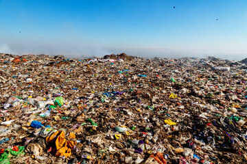 Burning trash piles in landfill