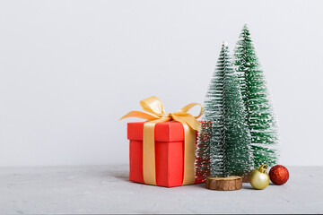 Christmas composition. craft Gift box, small tree, branches and craft DIY decorations on white background. New year concept. Christmas home decoration Flat lay, top view, copy space