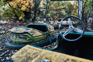 Abandoned Amusement Car Ride in Ghost City of Pripyat in Chernobyl Exclusion Zone, Scooter in Autumn Colors
