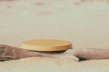 Empty round beige platform podium and dry tree twig on the beach