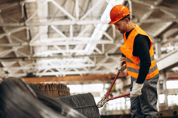 Man cutting steel at the factory