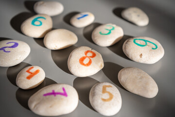 Colorful stones signed by numbers, an alternative method of children education. Number 8 in center