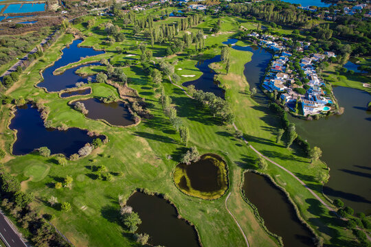 Aerial view of the salt marshes of the Camargue in southern France with plush beautiful golf course of la Grande Motte just beside the Mediterranean Sea
