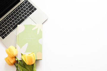 Flat lay woman's office desk. female workspace with laptop, diary ,clipboard ,glasses on white background