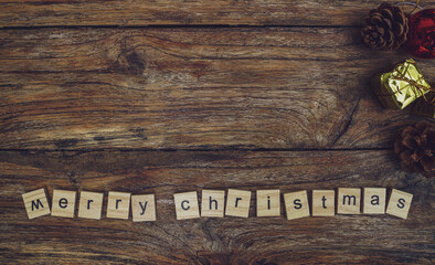 Merry Christmas. Christmas greeting card with rustic wood and ornaments.