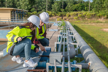 Environmental engineers work at wastewater treatment plants,Water supply engineering working at...