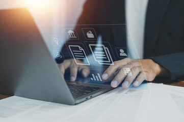 Documents management information system concept, Businessman using computer internet for Documents management information system and ERP program data directory in company, ERP document management © Suriyo