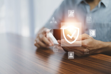 Man using mobile phone buy insurance online, insurance concept