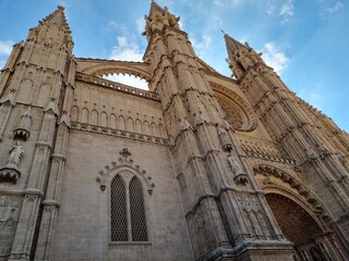 Fototapeta na wymiar Side view of towers of the cathedral la Seu of Palma de Mallorca in Spain