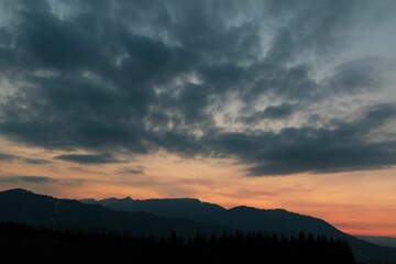 Beautiful sunset in the mountains with abstract clou