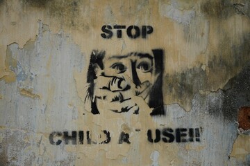 Street art sign stopping child abuse
