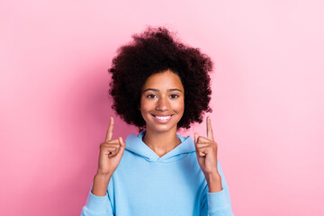 Photo of positive girl wear blue clothes hand direct empty space offer proposition black friday sale isolated on pink color background