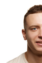 Half-face portrait of young man with shaved face and smooth perfect skin isolated over white studio background. Smiling. Concept of men's health
