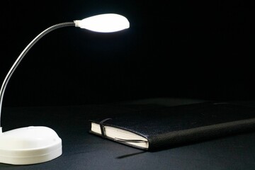 Book with a reading lamp