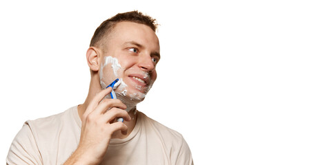 Smooth skin. Man shaving face with cream isolated over white studio background. Refreshment. Concept of men's health, body and skin care