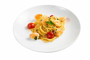 Plate of spaghetti with tomatoes and seafood on the white background depicted from an angle