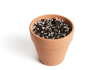 Fototapeta na wymiar Terracotta pot with porous soil mixture in isolated white background.