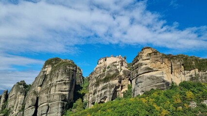 Low angle shot of the Holy Monastery of Rousanos Saint Barbara building on top of a hill