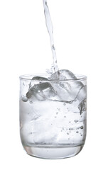 pour water in glass with ice  isolated on white background clipping path