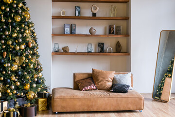 Stylish christmas living room interior with bege sofa, christmas tree and wreath