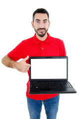 Casual bearded man showing blank laptop computer screen and thumb up. Isolated on white background. 
Studio shot