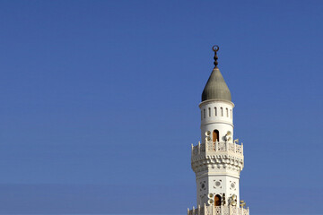 Madinah, Saudi Arabia - December 28, 2017 : Quba mosque in Medina. Quba mosque tower in blue isolated background