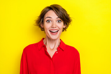 Photo of ecstatic gorgeous optimistic woman bob hairdo wear red shirt impressed by super season sale isolated on yellow color background