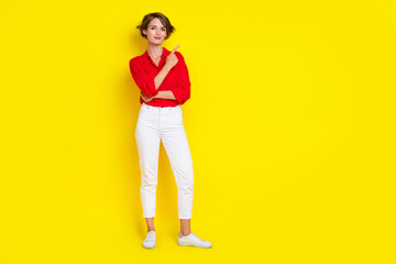 Fototapeta premium Full size portrait of pretty charming girl indicate finger empty space proposition isolated on yellow color background
