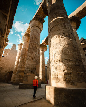 tourist exploring karnak temple in luxor egypt