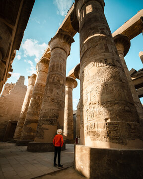 tourist exploring karnak temple in luxor egypt