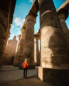 tourist exploring karnak temple in luxor egypt