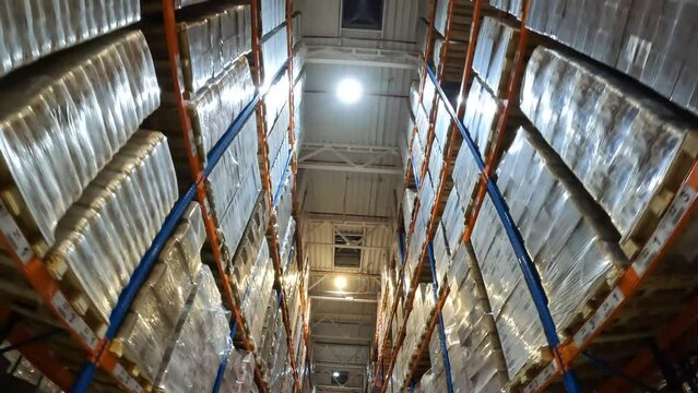 Industrial interior in a warehouse with boxes. Flight in a large modern warehouse.