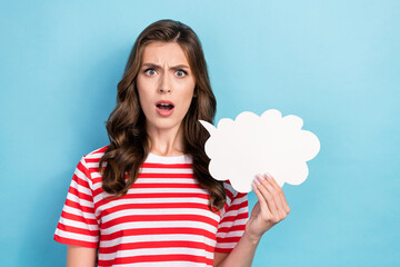 Photo of impressed surprised lady wear striped t-shirt rising speaking bubble empty space isolated blue color background