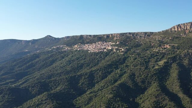 Slow motion and an aerial footage of Sardinia village, a rural area with Baunei mountains.