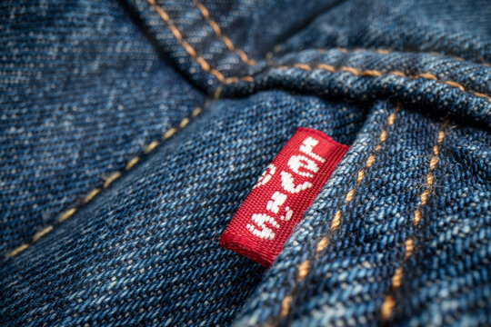 Fort Collins, CO, USA - November 7, 2022: Closeup of a Levis red label on Levi-Strauss trucker jacket. Levi Strauss Co. is American clothing company known worldwide for denim jeans.
