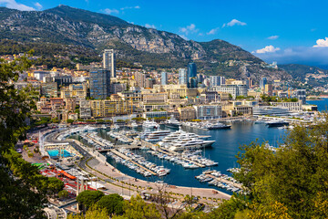 Naklejka premium Panoramic view of Monaco metropolitan area with Hercules Port, La Condamine, Monte Carlo and Fontvieille quarters at Mediterranean Sea coast