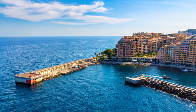 Panoramic view of Monaco metropolitan area with Port Fontvielle yacht marina with surrounding residences at Mediterranean Sea coast