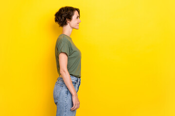 Side profile photo of cheerful lovely girl with bob hairstyle wear khaki t-shirt look empty space...