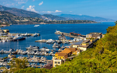 Fototapeta na wymiar Panoramic view of Monaco metropolitan area with Hercules Port and Monte Carlo quarter at Mediterranean Sea coast