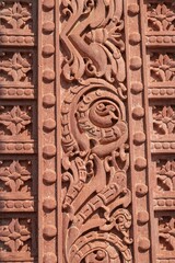 Vertical closeup of a historic Hindu temple entrance carvings in Jodhpur