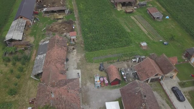 Aerial of fields next to houses in Gunja, Croatia