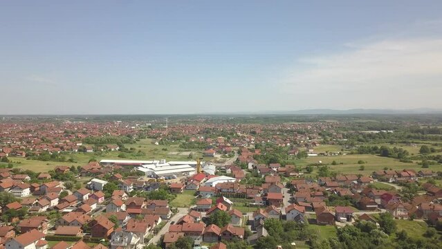 Aerial of the red-roofed houses surrounded by trees in Brcko district, Bosnia and Herzegovina