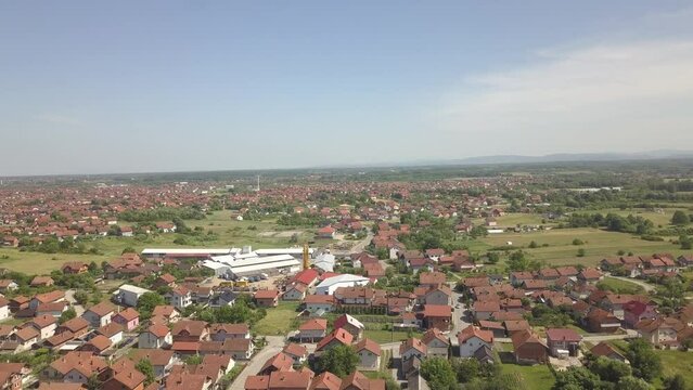 Aerial of the red-roofed houses surrounded by trees in Brcko district, Bosnia and Herzegovina
