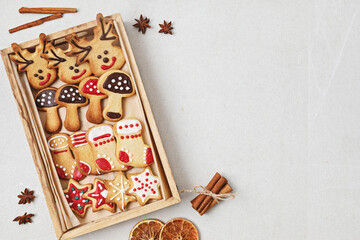 Traditionals Christmas homemade cookies preparation. Winter holidays celebration. Xmas biscuits with icing for diy gifts