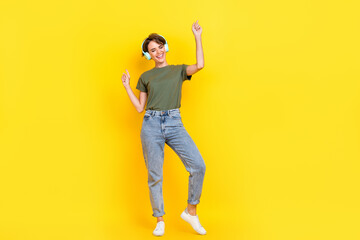 Full length photo of overjoyed lady stylish clothes eyes closed favorite playlist disco empty space isolated on yellow color background